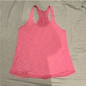 Lululemon pink tank with striped material and back cut out for breath ability